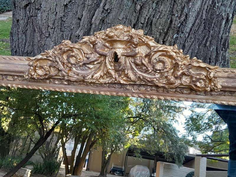 A French Rococo Style Ornately Carved & Gilded Bevelled Mirror