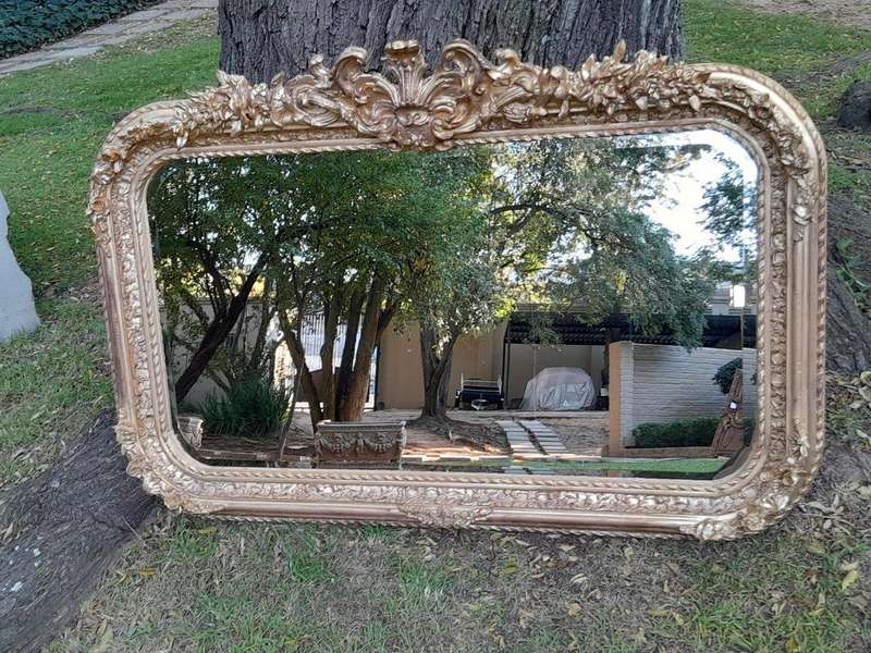 A French Rococo Style Ornately Carved & Gilded Bevelled Mirror