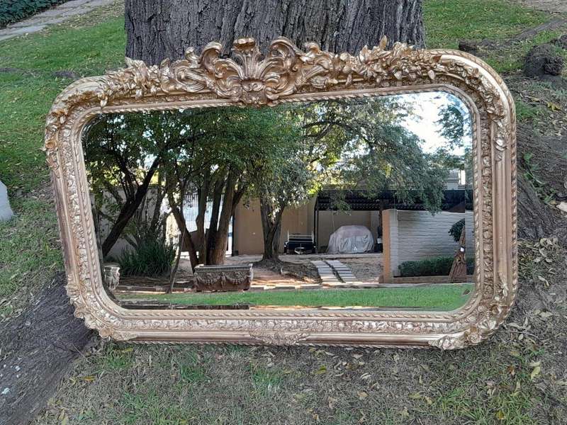 A French Rococo Style Ornately Carved & Gilded Bevelled Mirror