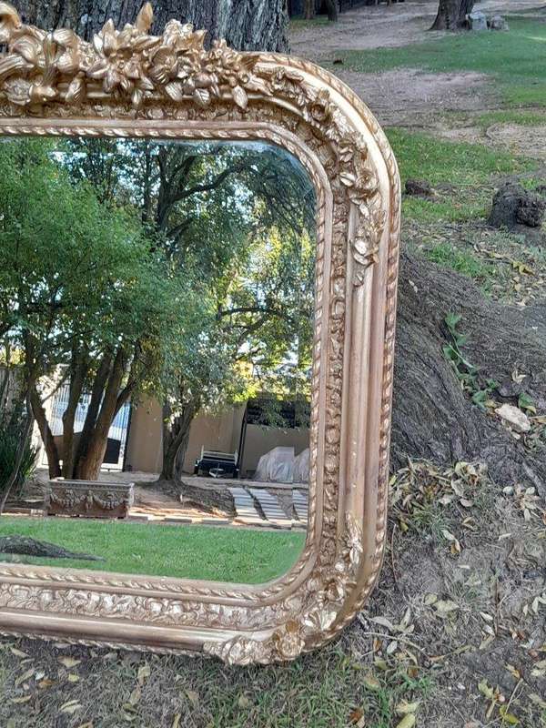 A French Rococo Style Ornately Carved & Gilded Bevelled Mirror
