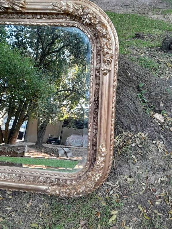 A French Rococo Style Ornately Carved & Gilded Bevelled Mirror