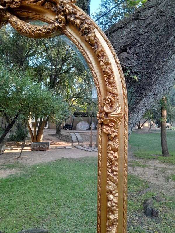 A French Rococo Style Ornately Carved & Gilded Bevelled Mirror