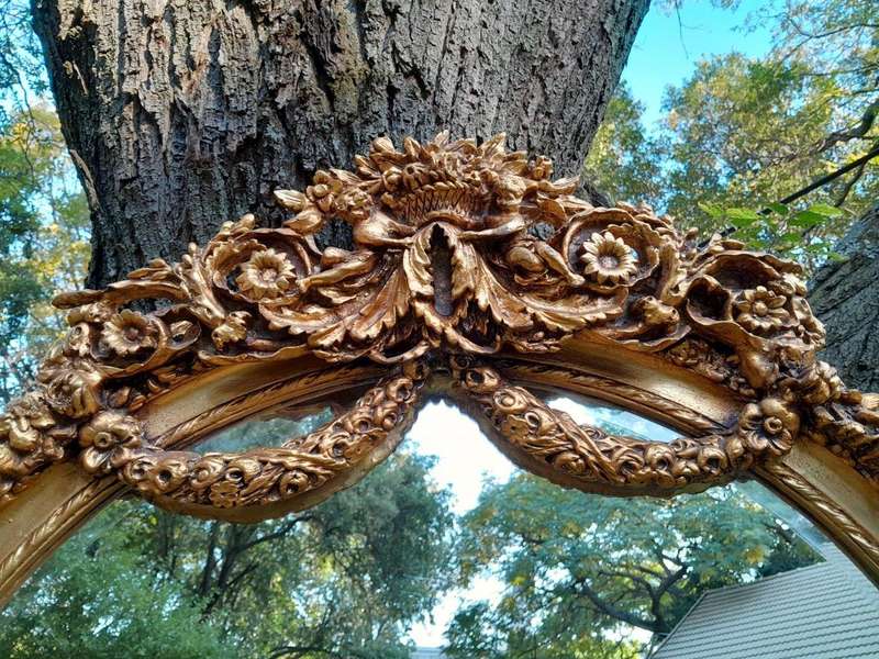 A French Rococo Style Ornately Carved & Gilded Bevelled Mirror