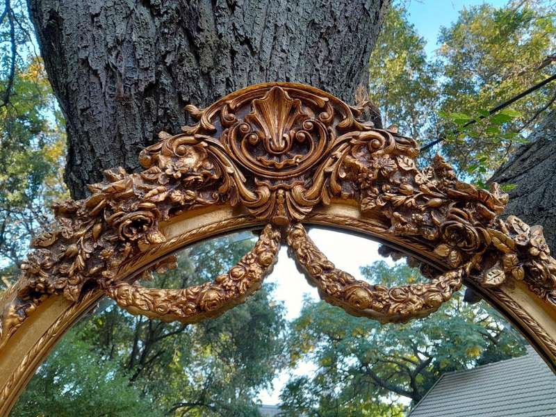 A French Rococo Style Ornately Carved & Gilded Bevelled Mirror