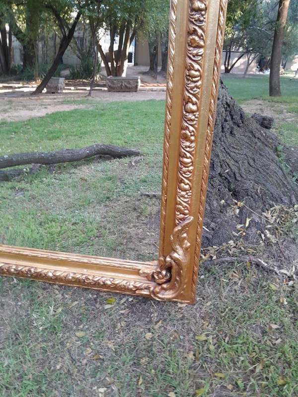 A French Rococo Style Ornately Carved & Gilded Bevelled Mirror
