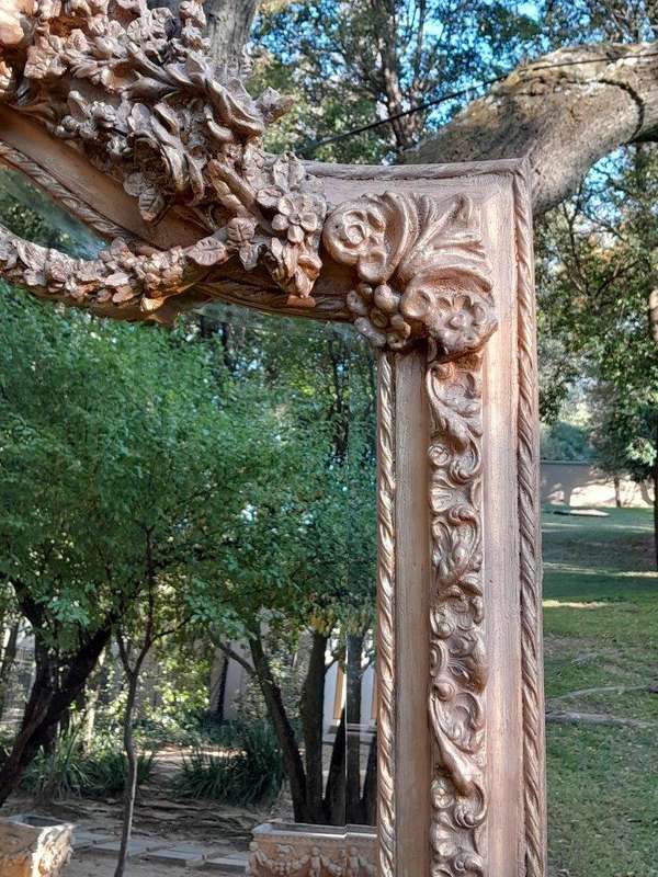A French Rococo Style Ornately Carved & Gilded Bevelled Mirror