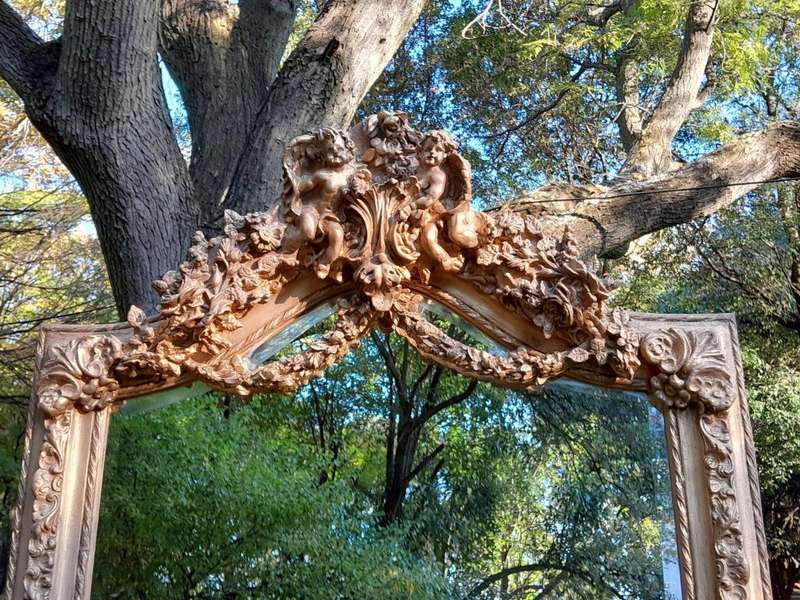 A French Rococo Style Ornately Carved & Gilded Bevelled Mirror