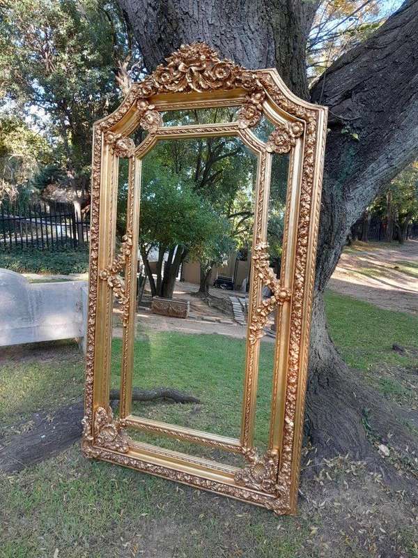A French Rococo Style Ornately Carved & Gilded Bevelled Mirror