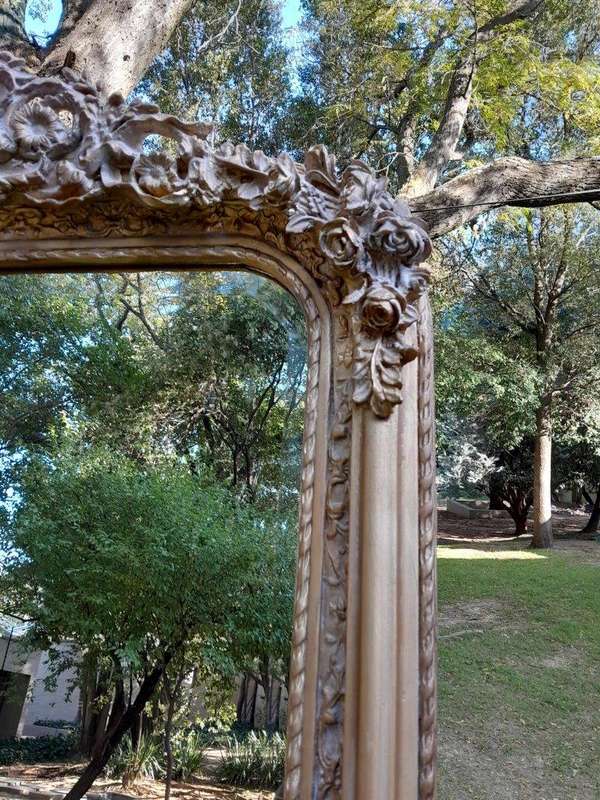 A French Rococo Style Ornately Carved & Gilded Bevelled Mirror