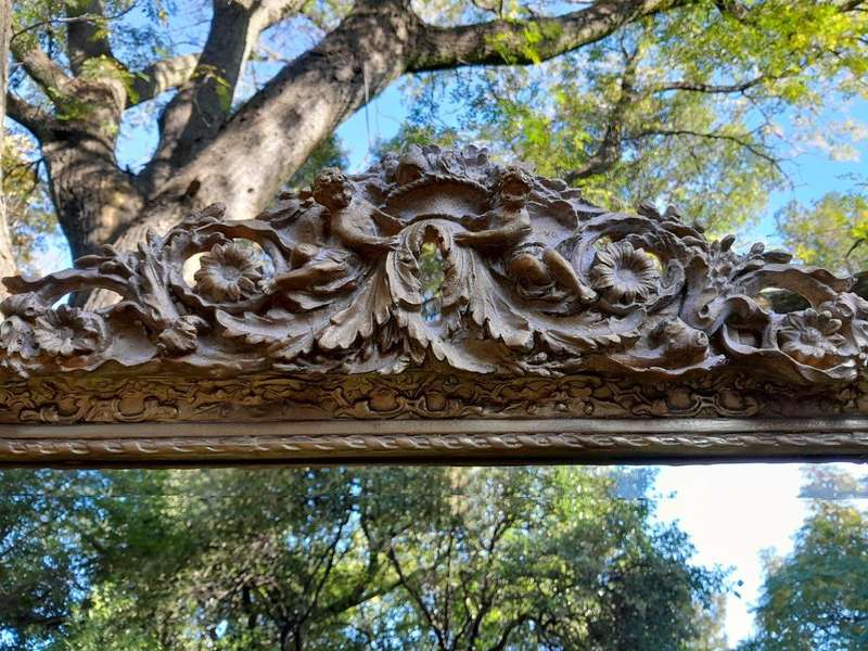 A French Rococo Style Ornately Carved & Gilded Bevelled Mirror