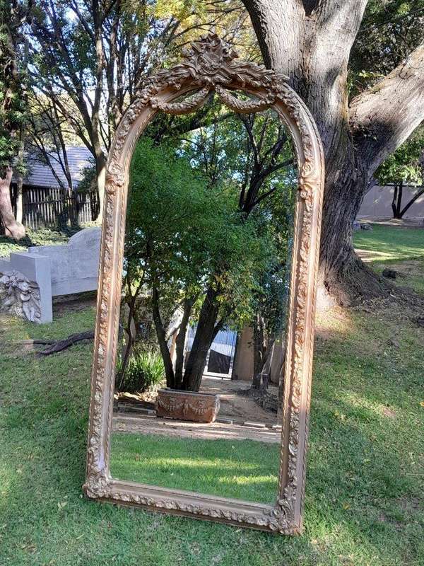 A French Rococo Style Ornately Carved & Gilded Bevelled Mirror