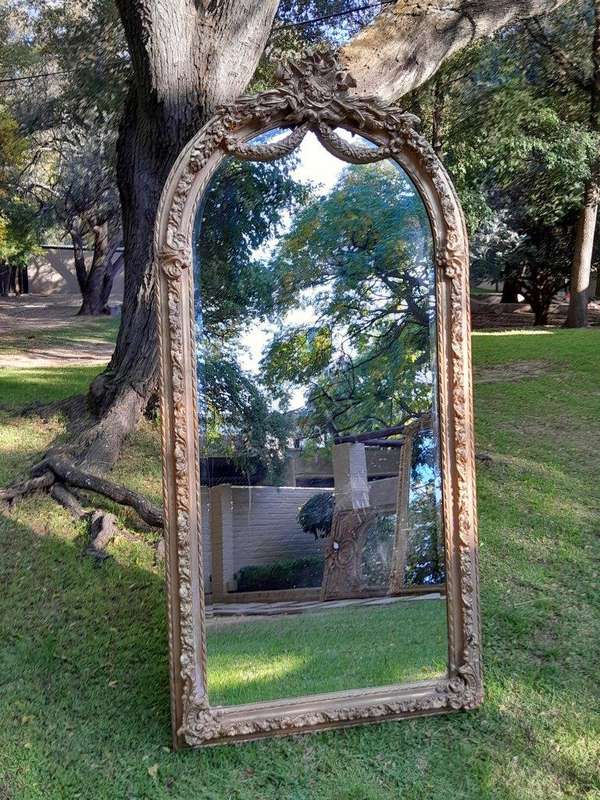 A French Rococo Style Ornately Carved & Gilded Bevelled Mirror