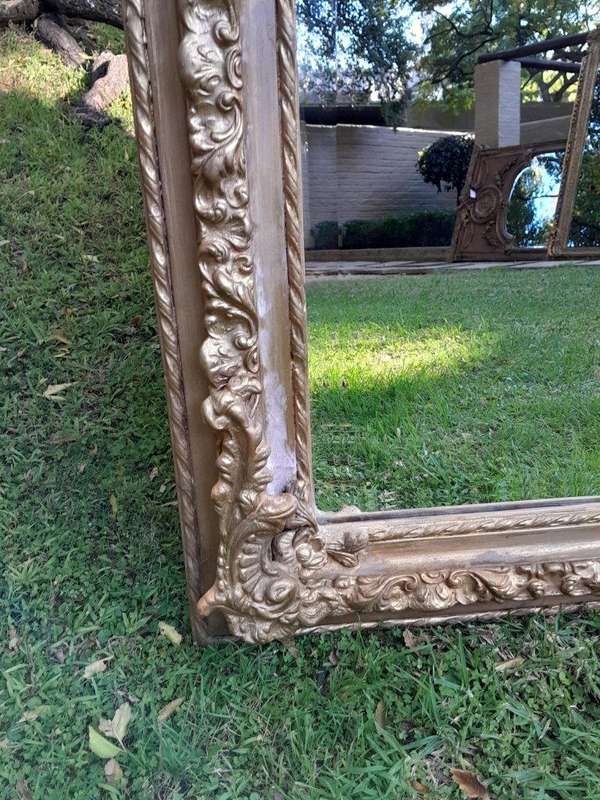 A French Rococo Style Ornately Carved & Gilded Bevelled Mirror