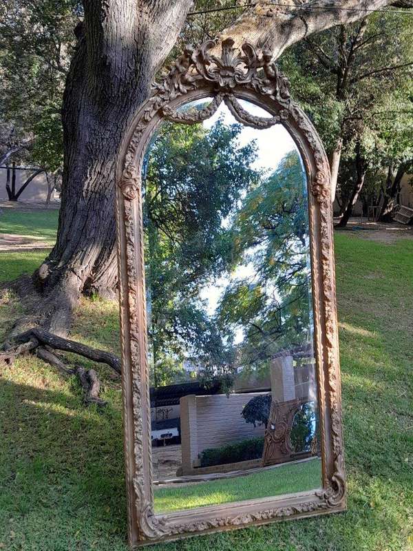 A French Rococo Style Ornately Carved & Gilded Bevelled Mirror