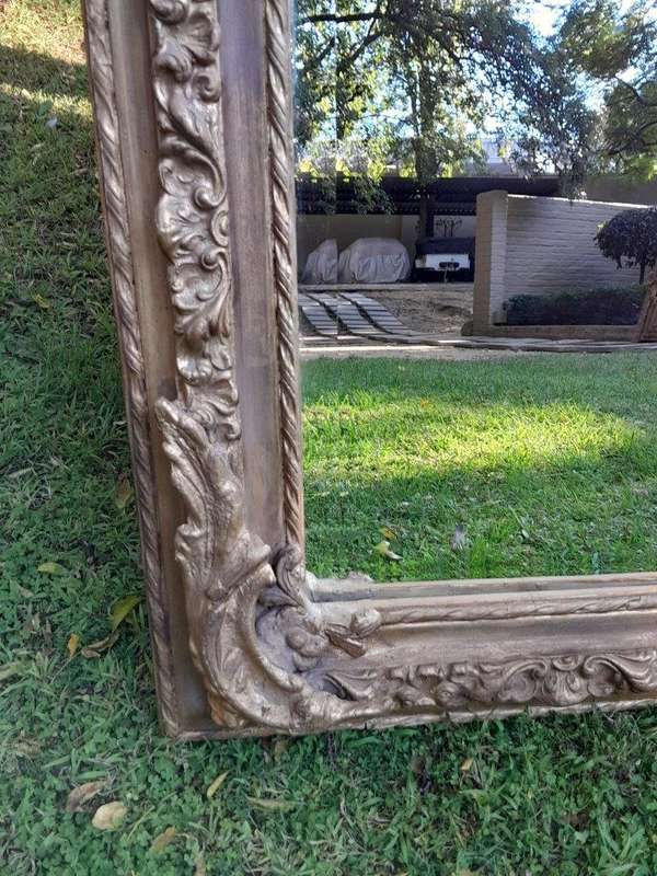 A French Rococo Style Ornately Carved & Gilded Bevelled Mirror