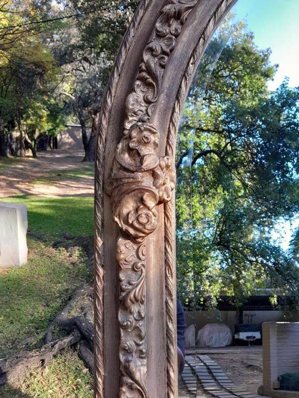 A French Rococo Style Ornately Carved & Gilded Bevelled Mirror