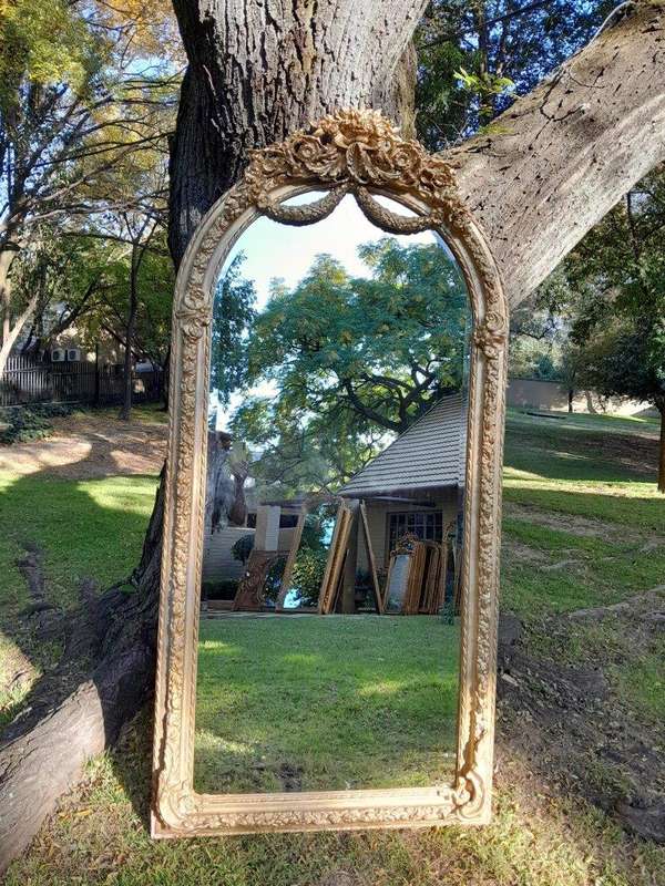 A French Rococo Style Ornately Carved & Gilded Bevelled Mirror