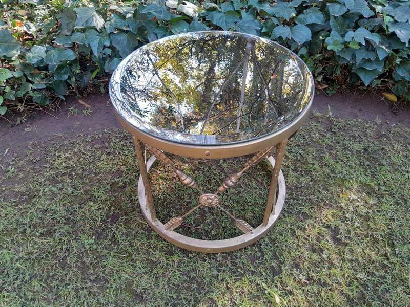 A Custom-made Gilt Metal Circulate Table with Bevelled Mirror