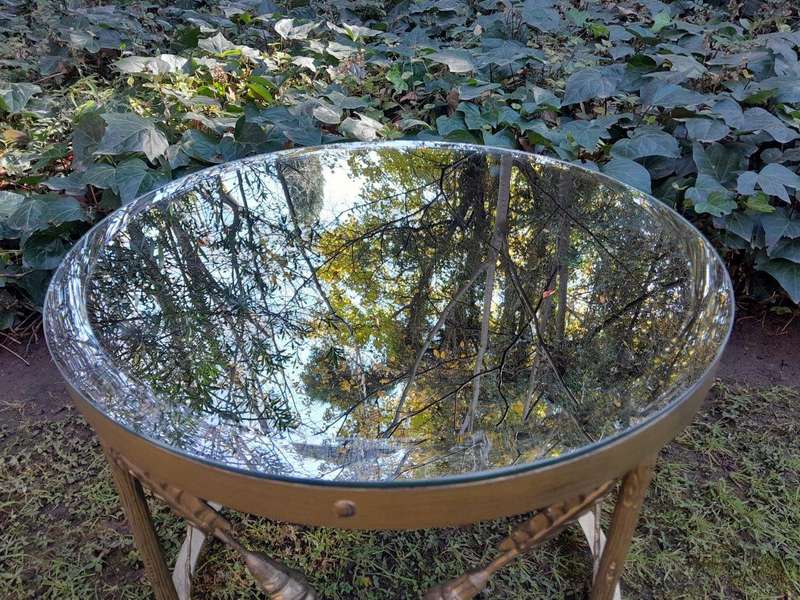 A Custom-made Gilt Metal Circulate Table with Bevelled Mirror