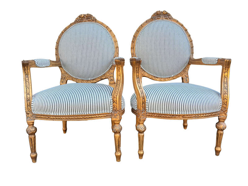 A 20TH Century French Style Pair Of Ornately Carved Giltwood Armchairs
