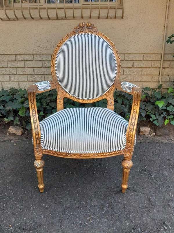 A 20TH Century French Style Pair Of Ornately Carved Giltwood Armchairs
