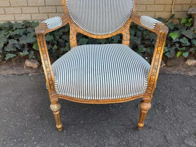 A 20TH Century French Style Pair Of Ornately Carved Giltwood Armchairs