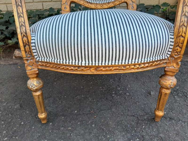 A 20TH Century French Style Pair Of Ornately Carved Giltwood Armchairs