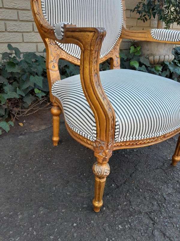 A 20TH Century French Style Pair Of Ornately Carved Giltwood Armchairs