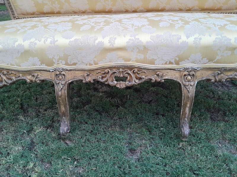A 20th Century Circa 1950 French Style Ornately Carved Giltwood Settee