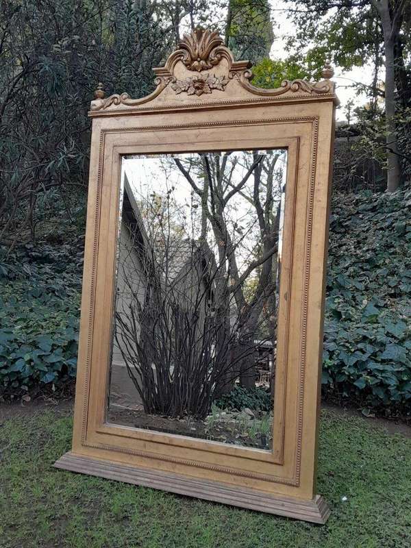 A Massive 20th Century French Style Ornately Carved and Gilded Bevelled Mirror