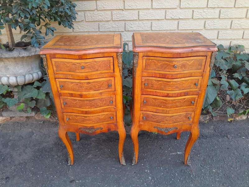 A 20th Century Circa 1920 Pair of French Walnut and Inlaid Bowfront Pedestals with Gilt Metal M...
