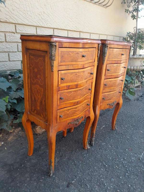 A 20th Century Circa 1920 Pair of French Walnut and Inlaid Bowfront Pedestals with Gilt Metal M...
