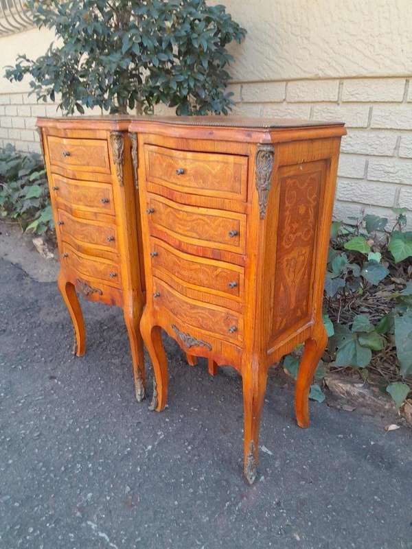 A 20th Century Circa 1920 Pair of French Walnut and Inlaid Bowfront Pedestals with Gilt Metal M...