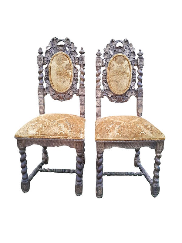 A Pair of 19th Century French Ornately Carved and Gilded Chairs