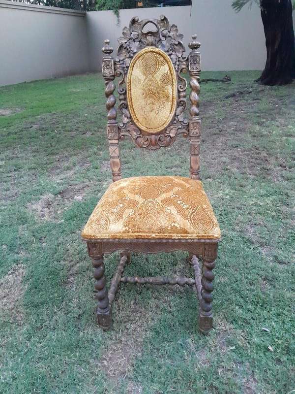 A Pair of 19th Century French Ornately Carved and Gilded Chairs