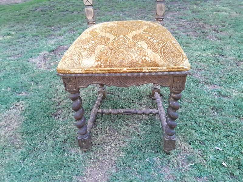 A Pair of 19th Century French Ornately Carved and Gilded Chairs