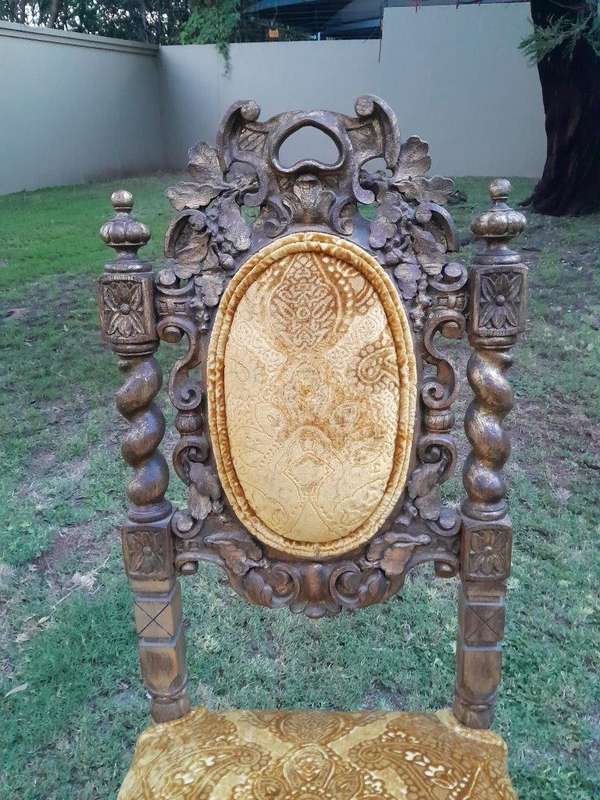 A Pair of 19th Century French Ornately Carved and Gilded Chairs