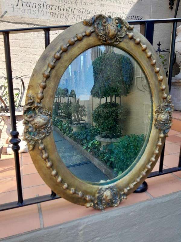 A 20TH Century Gilt Oval Mirror With Convex Mirror