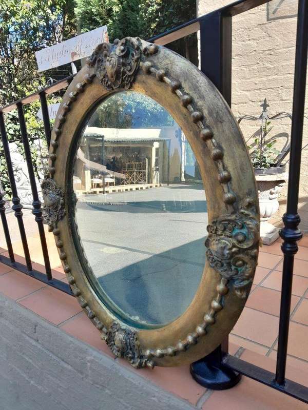 A 20TH Century Gilt Oval Mirror With Convex Mirror