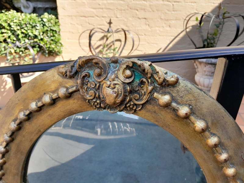 A 20TH Century Gilt Oval Mirror With Convex Mirror