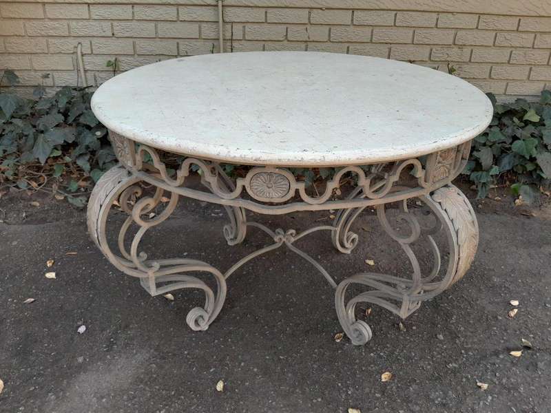 A 20th Century French Style Wrought Iron Circular Table with Cream Top