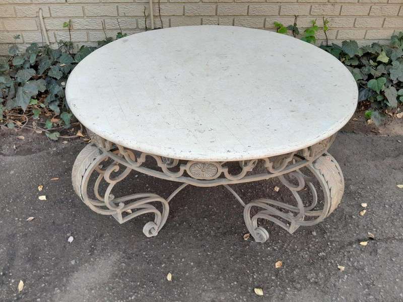 A 20th Century French Style Wrought Iron Circular Table with Cream Top