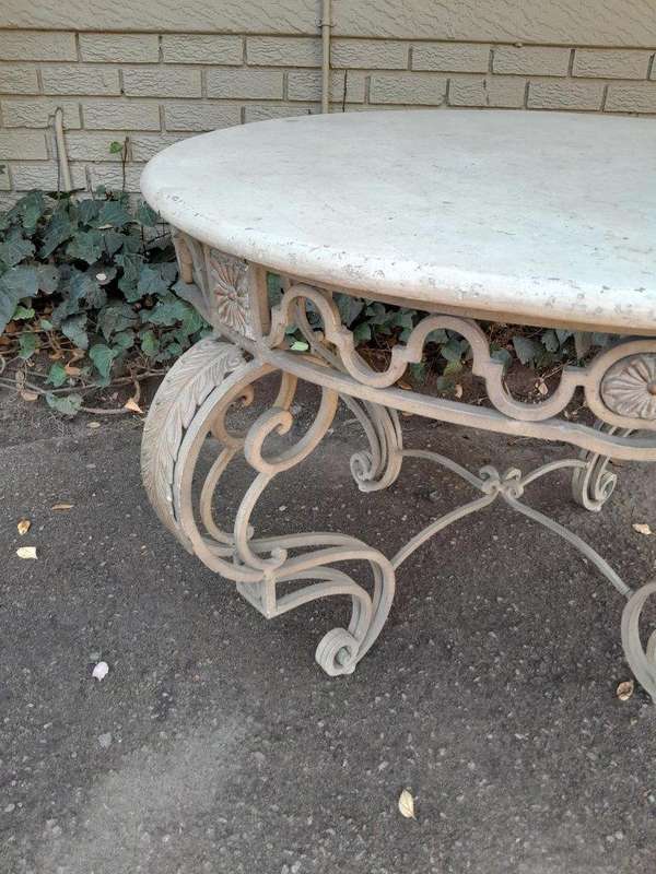 A 20th Century French Style Wrought Iron Circular Table with Cream Top