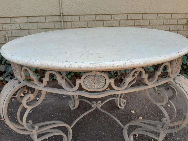 A 20th Century French Style Wrought Iron Circular Table with Cream Top