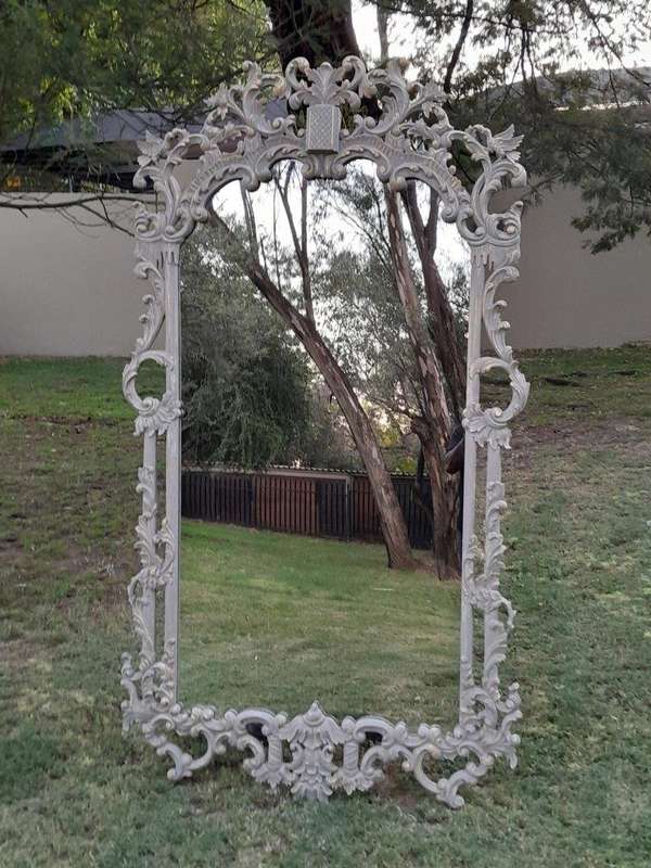 A 20th Century French Style Carved Grey and Gilded Mirror