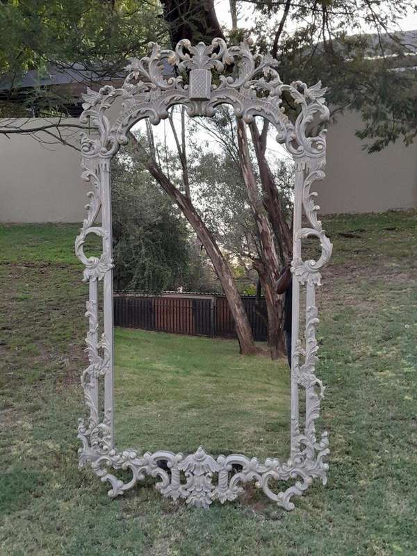 A 20th Century French Style Carved Grey and Gilded Mirror
