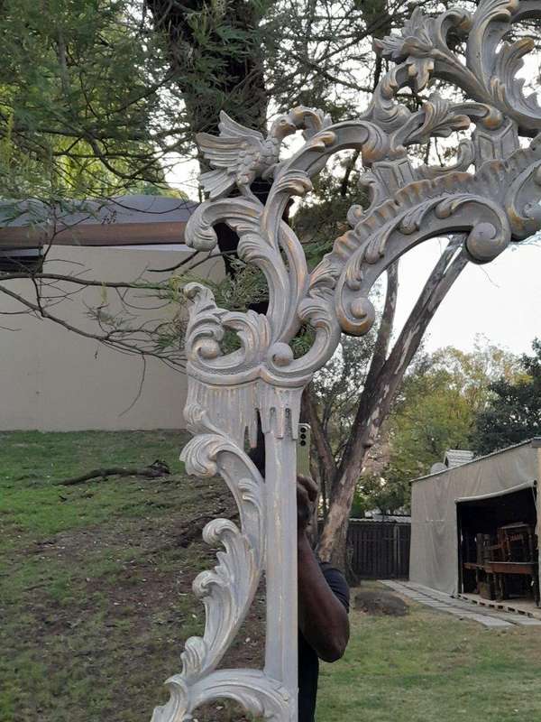 A 20th Century French Style Carved Grey and Gilded Mirror