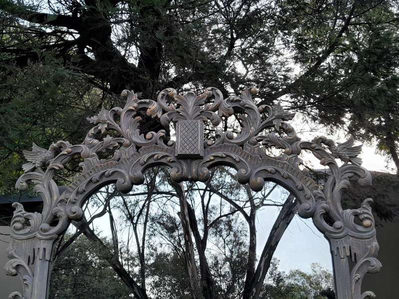 A 20th Century French Style Carved Grey and Gilded Mirror