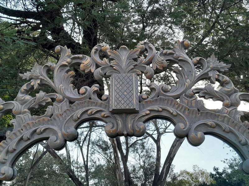 A 20th Century French Style Carved Grey and Gilded Mirror