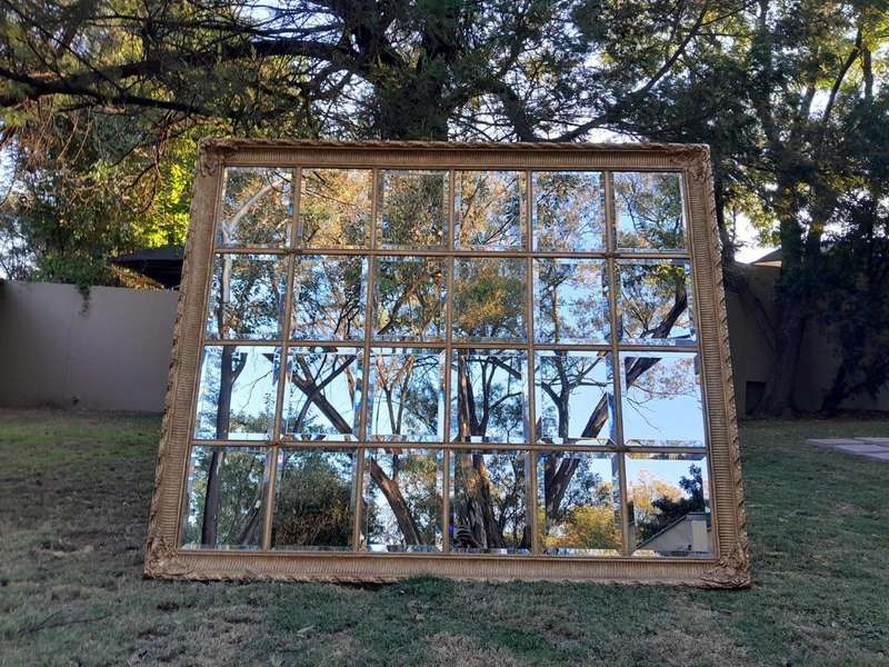A French Style Heavily Carved and Gilded Framed Mirror with Bevelled Mirror Panes of Large Propor...